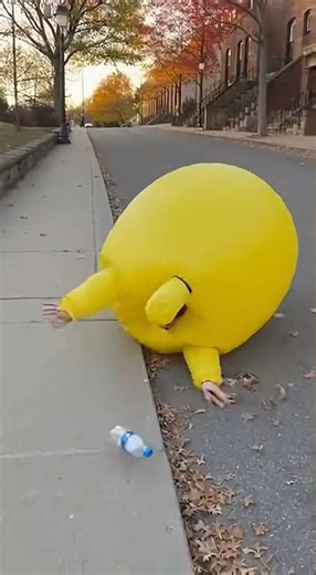 Yellow Inflatable Suit Chaos as He Chases a Rolling Water Bottle 😂