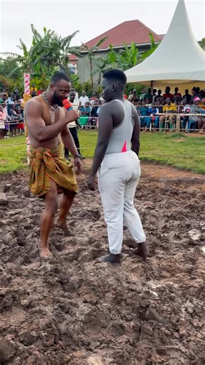 SGW softgroundwrestlinguganda on Instagram: "An intense mud wrestling fight inside an outdoor African mud ring arena. Two powerful wrestlers facing off: • Zampi – fierce, aggressive female mud wrestler, explosive energy, wild intensity • Nigerian Prince – dominant, confident, muscular fighter with royal presence?"