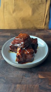 Juicy, smoky, maple-glazed bacon burnt ends - if you’re bringing these to the tailgate, expect to be asked to bring them again. 😌 ~ Ingredients: 1 pound cured slab bacon, cut into 1 1/2-inch cubes 2 tablespoons mustard 1/4 cup barbecue rub 1/2 cup butter, cubed 1/4 cup barbecue sauce 1/4 cup maple syrup | Tastemade