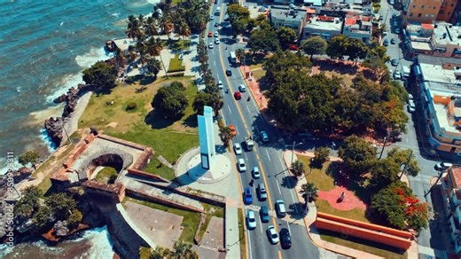 Aerial view of the coast of Santo Domingo. Dominican Republic monuments and squares. View of the city and Caribbean Sea from above. Coast in the city center. Landscape by the sea. Capital by the ocean