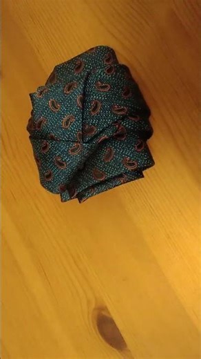 Kung fu origami silk ties. Fighting fist with wood layering under.