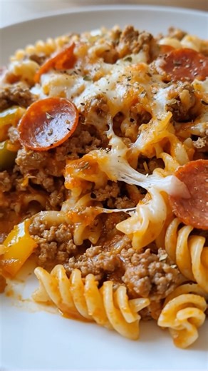 Easy Pizza Casserole A fun, cheesy bake with all the flavors of pizza, ideal for post-holiday meals after Christmas or Thanksgiving when everyone wants comfort food fast. Ingredients: 1 lb (450 g) ground beef or Italian sausage 2 cups uncooked rotini or penne pasta 1½ cups pizza sauce or marinara 1 tsp Italian seasoning 1½ cups shredded mozzarella ½ cup shredded cheddar ¼ cup sliced black olives (optional) ¼ cup mini pepperoni or sliced pepperoni 1 tbsp olive oil Optional: red pepper flakes or f