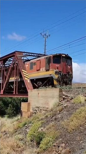 A South Bound Rovos Rail crosses the Geelbek River with 2 Transnet 18Es