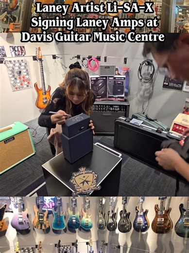 Laney Artist Li-SA-X signing Laney Amps with her autograph at Davis Guitar Music Centre Singapore. These special Limited Edition Laney Amps with Laney Artist Li-SA-X autograph are available at Davis Guitar Music Centre Singapore. Laney Artist Li-SA-X meet and greet event in Singapore at Davis Guitar Music Centre on 12th September 2025. Li-SA-X signed Laney Amps with her autograph at Davis Guitar Music Centre Singapore. Special Limited Edition Laney Amplifiers with Li-SA-X autograph are available