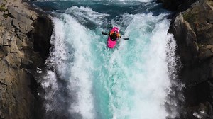 Riding a kayak over a 134-foot waterfall