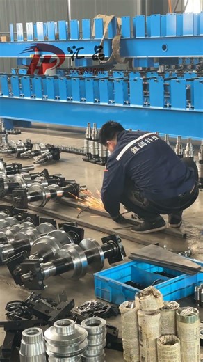 The worker is installing the machine.