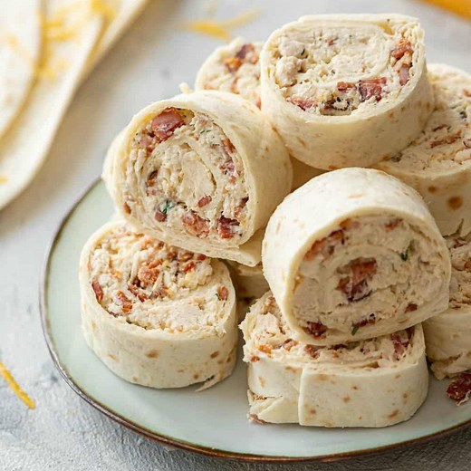 RECIPE HERE: https://therecipecritic.com/chicken-bacon-ranch-pinwheels/ Chicken Bacon Ranch Pinwheels are an easy wrap your party guests will love with chicken, bacon, cheese and ranch seasoning. They’re delicious either hot or cold! | Tried and True Recipes