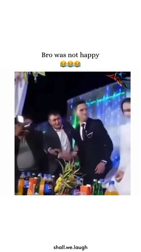 Shall we laugh? on Instagram: "This video captures a chaotic and viral wedding moment where a groom's patience reaches its breaking point. In the clip, the bride playfully teases him by repeatedly pulling back the wedding cake as he tries to take a bite, all while Whitney Houston’s "I Will Always Love You" plays dramatically in the background. The tension peaks when the groom, clearly frustrated by the public prank, reacts by slapping a guest who was filming nearby and storming off, leaving the 