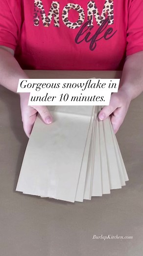 15M views · 315K reactions | Make a gorgeous snowflake in under 10 minutes. #snowflakes #craftcommunity #burlapkitchen #christmascrafts #diycrafts #easycrafts #papercrafts #christmasdecorating | Burlap Kitchen | Facebook