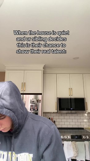 Sibling Talent Show in a Modern Kitchen