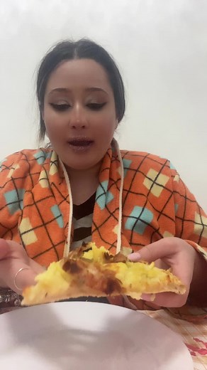 Colorful Pizza Eating Video with Unique Checkered Robe
