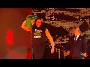Brock Lesnar celebrates his Money in the Bank win on Raw