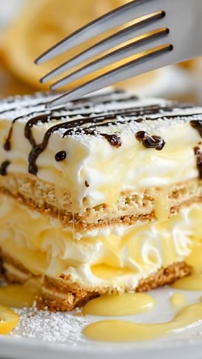 With bright lemon pudding and soft graham crackers, this no-bake dessert layers into a creamy, refreshing treat. It chills into the perfect slice — light, zesty, and so easy to assemble, making it a simple, crowd-pleasing dessert for any night. | Recipe Stories