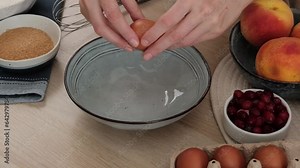 The process of making a shortcrust pastry pie. Kneading the dough and making buttercream. Woman prepares a sweet shortbread pie with peaches and cranberries.Video recipe - step by step cooking