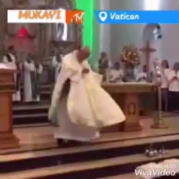 A Catholic Priest dances in church