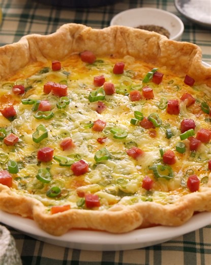 My endlessly adaptable and exceptionally easy Quiche Recipe is the back-pocket brunch recipe everyone should have. The savory egg custard filling is flavored with your choice of mix-ins and baked into a buttery crust—it's the perfect canvas for your culinary creativity! | Preppy Kitchen