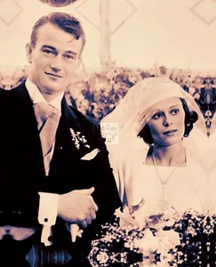 "On June 24, 1933, John Wayne and his first wife, Josephine “Josie” Saenz, were photographed on their wedding day outside the Church of Our Lady of the Angels in Los Angeles, beneath the bright California sun and the watchful gaze of Hollywood insiders. Wayne, still credited as Marion Morrison in some circles, had just begun making a name for himself after the 1930 release of The Big Trail, and stood in a crisp dark suit, his tall frame striking even then. Josie, the daughter of a prominent Pana