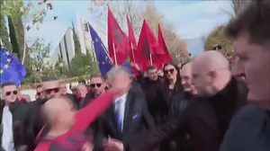 Albanian opposition leader punched in face as he marches to protest