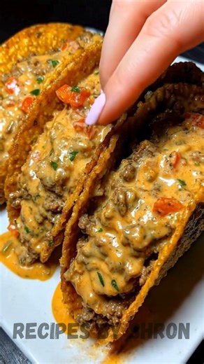 Cheesy Rotel Beef Tacos Ingredients: • 3 lbs ground beef • 1 to 2 tbsp olive oil • 1 medium onion, diced • Taco seasoning • 2 tbsp butter • 1/3 cup all-purpose flour • 2 1/2 cups milk • 2 cans (10 oz each) Rotel, undrained • 2 blocks cheddar cheese, freshly shredded • 1/3 cup sour cream • A few dashes hot sauce • Nacho cheese flavored hard taco shells • Optional: Spanish rice, for serving | Recipes by Sharon