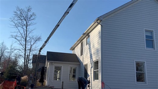 Ever wonder how we get concrete in a back yard? Right over the house of course! | Concept Concrete Construction