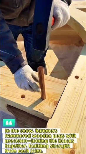 the process of installing wooden nails into wooden joints.