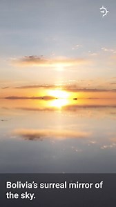 Bolivia's mirror of the sky is both amazing and otherworldly. 😲 This is the Salar de Uyuni, a salt flat high in the Andes mountains of South America. Covering over 3,900 square miles, it's the largest salt flat in the world. After a rare rainstorm, the Salar de Uyuni transforms into a surreal and stunning natural mirror. 😲🌧️ It reflects the sky so flawlessly that the horizon becomes almost invisible. Amazing and beautiful! | Atlas Mirabilium