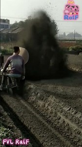 The plow machine sprays the plowed soil during the plowing process