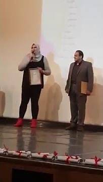 6'5" Tall Strong Jihan Mustafa Towering Over All the Men Standing Next to Her
