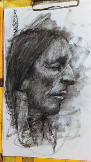 A Native American Men Face Drawing Using Charcoal