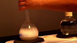 A boiling chemicals inside a flask in a laboratory