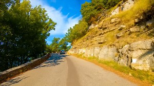 Alpine mountain road drive in the French Alps