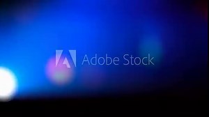 Strobe lights on the party, blurred laser light in a night club. Light background.