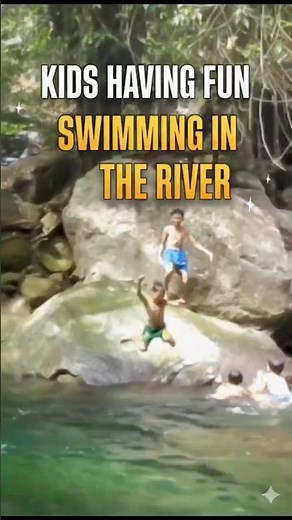 Kids having fun swimming in the river
