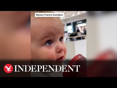 Adorable baby reviews high end candles in viral TikTok