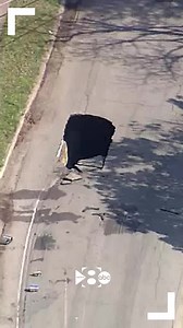 809K views · 4.8K reactions | GIANT SINKHOLE: Video captured by a WFAA viewer shows a truck hauling a trailer getting stuck in a large sinkhole that opened in a residential Dallas street Monday. Read more: https://www.wfaa.com/article/news/local/dallas-texas-sinkhole-truck/287-b4ce64da-0c20-4c70-89b7-bc0a08ec3e8f?utm_medium=social&utm_source=facebook_WFAA | WFAA | Facebook