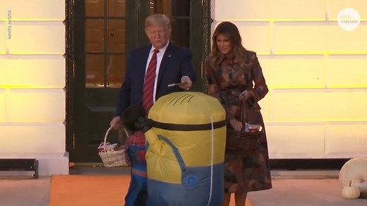 Pres. Trump puts Halloween candy on top of kid's 'Minion' costume