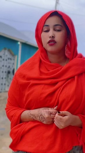 Elegant Red Garment and Intricate Henna Designs