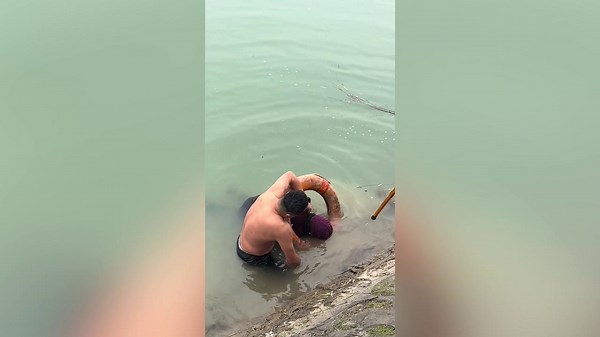 Brave man who could only doggy paddle saves drowning woman from freezing river