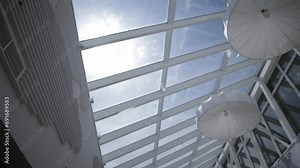 Viiew of the sun and blue sky through the window slide motion. Skylights. View from the window. View of the sky from the window