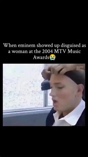 Gagy on Instagram: "Never forget the moment Eminem shocked the world at the 2004 MTV Video Music Awards by showing up in full disguise as an older woman. Sporting a wig, dress, and heavy makeup, he seamlessly blended into the audience, going completely unnoticed until the shocking reveal turned the scene into classic Eminem chaos. This stunt perfectly captured early-2000s VMA shock value, combining satire, trolling, and bold performance art in a way only Eminem could execute, leaving fans and vi