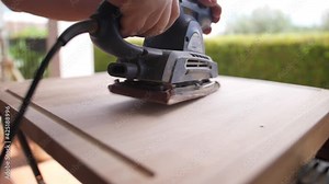 using belt sander to restore old wooden furniture
