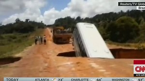 Bus washes away after collapsing in sinkhole