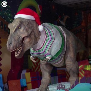9K views · 41 reactions | SANTA CLAWS: A festive makeover for the holiday season for the Tyrannosaurus rex at the Natural History Museum in London recently. The dino's giant sweater features the museum's newest prehistoric resident, Fern the Diplodocus, a 13-foot-tall and 22-foot-long bronze statue. To dress the dinosaur in the Christmas look, the museum said, "it takes a lot of people." | WCAX-TV | Facebook