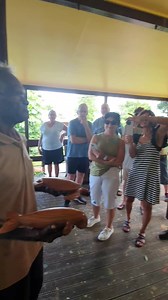 Lockhart River wood carver Uncle Vincent Temple talking to tourists about his works this morning at the Arts Centre, Monday 23 May 2022 | Lockhart River Arts Indigenous Corporation