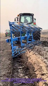 Modern Agricultural Plowing: Tractor-Drawn Reversible Plow in Field Preparation