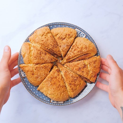 These light and fluffy layered scones have a delicious cinnamon sugar filling! Enjoy for breakfast or as an afternoon tea treat. Full recipe: https://trib.al/DEQdWpG | Good Housekeeping