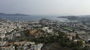 Bodrum is a city on the Bodrum Peninsula, stretching from Turkey's southwest coast into the Aegean Sea. The city features twin bays with views of Bodrum Castle.