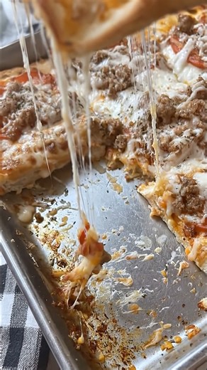 Cafeteria Lunch Pizza (School-Style) Ingredients Crust 2¼ tsp active dry yeast 1½ cups warm water (110°F / 43°C) 2 tbsp sugar 2 tbsp powdered milk (classic cafeteria flavor) 2 tbsp vegetable oil 1 tsp salt 3½–4 cups all-purpose flour Sauce 1 (6 oz) can tomato paste ¾ cup water 1 tbsp sugar 1 tsp dried oregano ½ tsp dried basil ½ tsp garlic powder ¼ tsp onion powder Salt to taste Topping 2 cups low-moisture mozzarella cheese, shredded Optional: cooked ground beef or sausage (school-style) Instruc