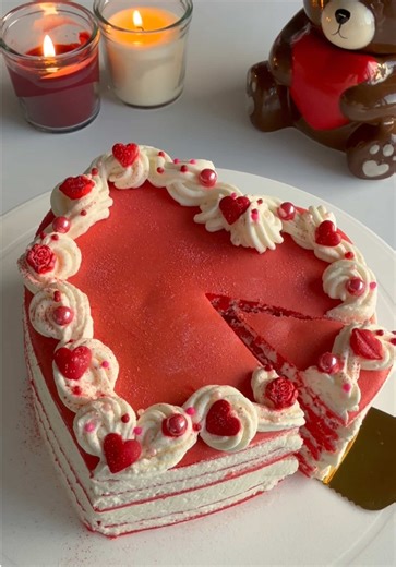 Heart-shaped Crepe Cake 🎂❤️ Red velvet crepe layers clouds of whipped cream = Valentine perfection ✨ Here’s how I made it: 🥞 Made Red Velvet crepe batter 🥄 Poured 1/3 cup into a heart-shaped non-stick pan, cooked each for 1 min 🧁 Layered with whipped cream between each 🎂 Covered with whipped cream ✨ Topped with Valentine-style sprinkles (red lips, roses, pearls & hearts) 🧊 Chilled in the fridge for 1 hour 🔪 Slice & serve! Perfect for Valentine’s, anniversaries, or just self-love moments �
