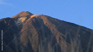 Summit of Teide volcano, scenic landscape at Teide National Park in Tenerife at Canary Islands of Spain, volcanic nature, sunny day, distant medium shot